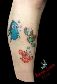 an image of a tattoo on the leg of a person with fish and seahorses