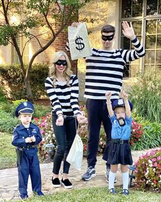 a man and two children are dressed up in costumes with money bags on their shoulders