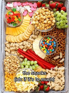 a tray filled with lots of different types of snacks