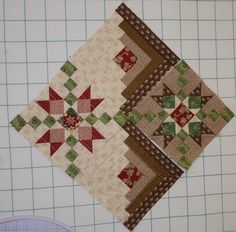 two patchwork quilts sitting on top of a cutting board next to each other