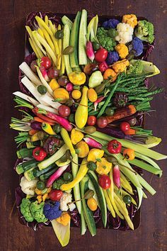 a platter filled with lots of different types of vegetables