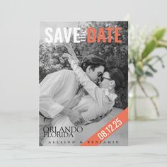 a save the date card with an image of two people kissing and holding each other