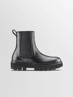 Chelsea Black Leather Boots for Women | Chelsea Nero | KOIO High Ankle Boots With Lug Sole For Workwear, Workwear High Ankle Boots With Lug Sole, High Ankle Chelsea Boots With Lug Sole For Work, Calf Leather Boots With Lug Sole For Work, Modern Chelsea Boots With Lug Sole, Calf Leather Ankle Boots With Contrast Sole, Calf Leather Chelsea Boots With Vibram Sole, Modern High-top Chelsea Boots With Lug Sole, Modern High Ankle Boots With Lug Sole