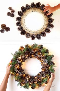 two hands are holding pine cones and wreaths with lights on the top, while another hand is reaching for one