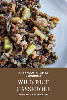 wild rice casserole with pineapples and carrots on a white plate