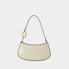 The Ollie hobo bag by Staud showcases a sleek, curved silhouette crafted from smooth leather with contrasting trim. A unique handle with gold and silver-tone rings introduces a playful element, and the spacious interior ensures that essentials are well-organized.

- Material: Smooth leather
- Handle: Unique design with gold and silver-tone rings
- Interior: Spacious for easy organization
- Style: Sleek, curved silhouette
- Trim: Contrasting details Luxury Everyday Baguette Bag With Handles, Elegant Everyday Baguette Bag With Round Handle, Daily Use Baguette Bag With Gold-tone Hardware, Elegant Baguette Bag With Detachable Strap And Round Handle, Chic Rectangular Baguette Bag For Daily Use, Chic Rectangular Baguette Bag For Everyday, Gold Baguette Shoulder Bag For Everyday Use, Chic Top Handle Baguette Bag With Palladium Hardware, Elegant Baguette Bag With Metal Hardware For Daily Use