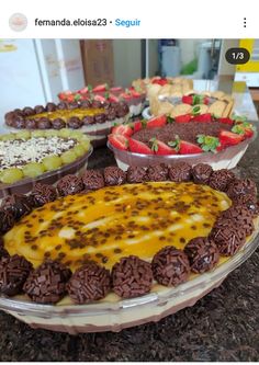 there are many different desserts on the table together, including one with chocolate and strawberries