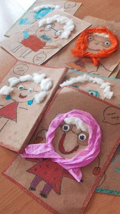 some paper bags with children's drawings on them