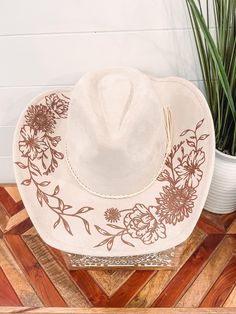 Wild Child Floral Burned Hat, Floral Engraved Cowboy Hat, Sunflower Hat, Sunflower Burned Fedora, Engraved Suede Hat, Boho Hat, Vegan Suede Elevate your style with our beautifully engraved floral hats! Choose from a variety of different hat colors. Band may shift or fall off during shipping. The hat has an adjustable ribbon on the inside and can fit anywhere from 20-24.5" heads. This hat can fit children and adults. If you are looking for a custom order, please message us! We ship all of our hat Cream Country Style Hat For Country Events, Cream Country Hat For Kentucky Derby, Country Style Cream Hat For Kentucky Derby, Cream Wide Brim Hat For Country Events, Western Style Felt Beach Cap, Cream Wide Brim Country Hat, Country Style Wide Brim Cream Hat, Cream Country Hat For Festivals, Country Style Cream Hat For Festivals