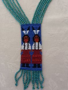 Genuine Navajo Seed Bead Necklace with 2 Indian Natives. Pre-owned by gift shop owner in Gallup, NM  around mid 20th century. Measures @ 17" long Multi strands and multi-colored beads: Turquoise, green, purple, brown, black, orange & white. Excellent condition. Blue Charm, Turquoise Green, Seed Bead Necklace, Multi Strand, Black Orange, Orange White, Bead Necklace, Seed Bead, Chain Styles