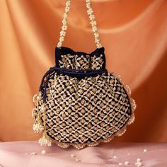 Pearl Sequin Beaded Navy Blue Velvet Potli Bag for Women | Wedding Favor Designer Handbag Drawstring Bag Bridal Bag Pouch Indian Handbag Size  : 10 x 8 Inches Pacakge Content : 1 Pcs Designed with the heart, this beautiful Potli or batawa bag are eye catchy and made of premium material. Key Features: Embroidery art work This potli is good match with both Indian and western outfits and are superb for wedding and festive parties This would be best complement to your designer saree, lenhga or any other kind of dress This is the combination of traditional and modern embroidery work This is enough to keep your accessories and all needed essentials and it can be a best gift for any woman. Bridal Bag, Potli Bags, Accessories Bags Purses, Sequin Beading, Wedding Bag, Modern Embroidery, Designer Handbags, Blue Velvet, Western Outfits