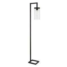 a black floor lamp with two clear glass shades on it's sides and a metal base