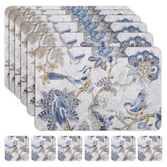 six coasters with blue flowers and birds on them