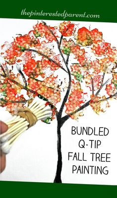 a hand holding a pair of scissors next to a tree with leaves on it and the words, bundled q - tip fall tree