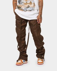 Change up your look with the Snap Zipper II Cargo Pants. Featuring zips down the side seams that are covered with snap buttons, these pants don't skimp on the detail. They also sport cargo pockets, a self-fabric built-in belt, and velcro closures at the cuffs. Cop yours today at Culture Kings. 

- Relaxed fit
- Snaps and zipper at outseam
- Tapered leg
- Built-in belt 
- Stiff fabric
- Cargo pockets
- Velcro closure at cuff
- Composition: 100% Nylon 
- Colour: Brown
- Style: M2019-P636-BRO Cargo Pants Men Outfit, Brown Cargo Pants Outfit, Cargo Pants Brown, Brown Pants Men, Cargo Pants Outfit Men, Brown Cargo Pants, Streetwear Fall, Drippy Outfit, Pants Outfit Men