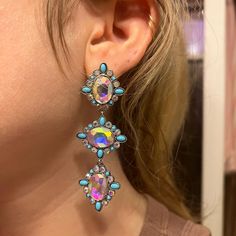 Want some extra glitz for a night out? These faux turquoise and iridescent crystal earrings will do the trick. They hang 3" long. For pierced ears. Turquoise Dangle Chandelier Earrings For Party, Turquoise Drop Crystal Earrings For Party, Turquoise Chandelier Earrings For Party, Trendy Turquoise Party Earrings, Iridescent Crystal, Turquoise Crystal, Pierced Ears, Crystal Earrings, Ear Piercings