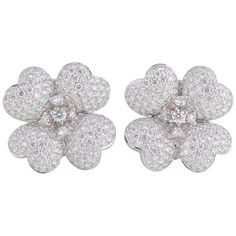 A fabulous pair of diamond flower earrings. Tons of sparkle set on 4 delicately designed flower petals. 4.16 carats of high quality F color VS clarity round brilliant cut diamonds set in 18k white gold. Approximately .78 inches in diameter. For pierced ears but can easily be converted into clips. Diamond Flower Earrings, Gold Flower Earrings, White Flower Earring, White Diamond Earrings, Earrings Diamond, White Gold Jewelry, Flower Tops, Earrings White, Diamond Flower