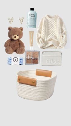 a teddy bear, sweater, and other items are arranged on a gray background