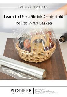 a basket filled with food sitting on top of a wooden table next to a roll of tape