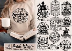 a woman is holding a cup and reading a book while wearing a sweatshirt with the words salem witch on it