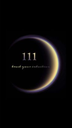 an eclipse with the words 11 1 on it in gold and black, against a dark background