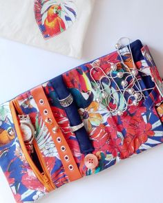 an orange and blue purse with buttons on it