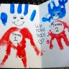 two children's handprints are shown in front of a computer keyboard