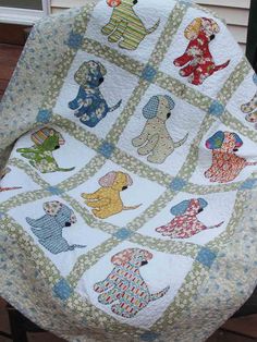 a quilted chair cushion with dogs on it