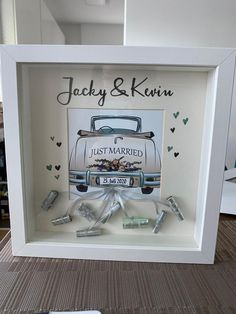 a wedding photo frame with the bride and groom's car on it, surrounded by money