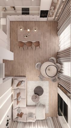 an overhead view of a living room and dining area from the top down to the kitchen