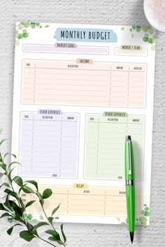 the printable planner is next to a cup of coffee and a pen on a table