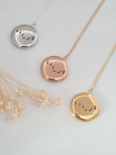 Antique and vintage inspired silver, gold or rose gold plated round floral embossed locket engraved with flying birds on the back of the locket.   Pictures can be added to both sides - see video tutorial https://www.wikihow.com/Put-a-Picture-in-a-Locket    Lovely bridesmaid gift, perfect for a keepsake gift. Simple and elegant. Locket measures 25mm and hangs on a fine silver, gold or rose gold plated chain. Necklaces will arrive in a bag ready for giving. Elegant Round Pendant Locket Necklace With Birth Flower, Elegant Round Locket Necklace With Birth Flower, Elegant Birth Flower Round Pendant Locket Necklace, Birth Flower Round Pendant Necklace For Keepsake, Dainty Round Keepsake Necklaces, Dainty Round Keepsake Necklace, Rose Gold Round Locket Necklace, Rose Gold Round Pendant Necklace For Keepsake, Nature-inspired Round Pendant Necklace For Wedding