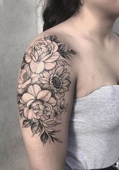 a woman with a flower tattoo on her arm