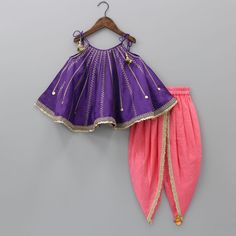 Dhotis & Patialas - Flared Top with sequins and thread embroidery on it , Top with knot to tie shoulder straps and coin tassels attached to it , Top with sequins lace work at hem , Dhoti with elasticated waist and lace work at front , Neck : Strappy round neck , Sleeves : Sleeveless , Closure : Knots to tie , Waistband : Elasticated Baby Girl Indian Dress, Kids Ethnic Wear Indian, Asian Prom Dress, Tie Knot Top, Tassels Fashion Clothing, Crochet Frock, Kids Indian Wear, Cotton Frocks For Kids, Baby Dress Diy