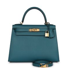 This Kelly, in the Sellier style, is in Vert Bosphore epsom leather with gold hardware, has tonal stitching, front flap, two straps with center toggle closure, clochette with lock and two keys a single rolled handle and removable shoulder strap. The interior is lined with Vert Bosphore chevre leather and has one zip pocket with an Hermes engraved pull and two open pockets on the opposite side. Collection: DOrigin: FranceCondition: New and never (plastic on hardware) Accompanied by: Hermes box, H Hermes Kelly Sellier, Kelly Sellier, Hermes Kelly Bag, Hermes Box, Kelly Bag, Hermes Handbags, Hermes Bags, Purses Designer, Leather Satchel