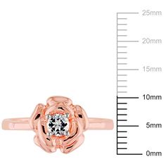 This pretty Created White Sapphire Flower Ring, crafted in pink rhodium over sterling silver, is a lovely gift for that special someone. The fashion ring features the sculpted petals of a flower adorned with a single round-cut, prong-set created white sapphire (4mm) at its center. Sapphire Flower Ring, Floral Ring, Fashion Ring, Sapphire Gemstone, Flower Ring, White Sapphire, Ring Collections, Types Of Rings, Gemstone Colors