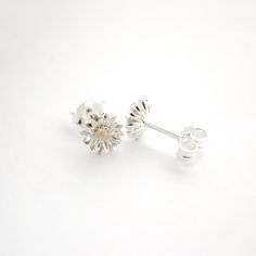 A beautifully designed 925 Sterling Silver Aster Flower Stud earrings with a Gold Plate stamen in the centre. The Aster is the September birth flower And is a symbol of love, wisdom, patience, faith, elegance, and beauty. A lovely gift for family or friends or maybe something nice for yourself.Your purchase will arrive in a organza gift pouch but if you would like a luxury ribboned box, as illustrated, then please select from the drop down menu.I will send your purchase untracked via Royal Mail, Sterling Silver Flower Charm Earrings For Anniversary, Sterling Silver Flower Earrings For Mother's Day, Sterling Silver Birth Flower Earrings, Mother's Day Sterling Silver Birth Flower Earrings, Sterling Silver Flower Earrings For Anniversary And Mother's Day, Classic Flower-shaped Earrings As Gift, Mother's Day Sterling Silver Flower Earrings, Dainty Sterling Silver Flower Earrings For Anniversary, Sterling Silver Birth Flower Earrings For Wedding