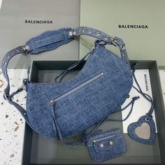 Description Balen Le Cagole XS Shoulder Bag In Blue Washed, For Women, Bags 13in/33cm Rep 1:1 Size: 33 x 16 x 8.4 cm /13 x 6.3 x 3.3 inches (Lenght x Height x Width) Shoulder bag Adjustable shoulder strap Braided shoulder pad Zipped closure with knotted puller 1 removable zipped pouch 1 removable heart mirror Includes dust bag. This product is of the best quality. Heart Mirror, Balenciaga Bag, Shoulder Pads, Fashion Statement, Designing Women, Contact Us, Fashion Bags, Balenciaga, Clutch Bag