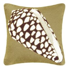 a brown and white pillow with an abstract design