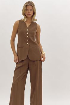 Unleash your playful side with the Tabitha Vest! This solid button up vest features faux pockets, adding some fun and flair to your wardrobe. Stay stylish and comfortable while turning heads with this quirky and versatile piece.

https://shopmiras.com Maxi Jumpsuit, High Waisted Bottoms, Quilted Puffer Vest, Short Kimono, Wedding Rehearsal Dinner, Car Coat, Wedding Rehearsal, Graphic Tops, Working Late