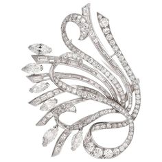 This stunning vintage 1960s lapel brooch of opulent aesthetic and unmatched sophistication depicts a very precious floral bouquet with marquise diamonds simulating flowers and buds and baguette and round-faceted diamonds covering the romantically scrolled elongated stems. Rendered in solid platinum, this alluringly Edwardian inspired lapel pin brooch is swathed cumulatively in 15.51cts of high quality diamonds graded H-I color and VSclarity with few SI’s. This artfully designed floral bouquet fe Argentium Silver Jewelry, Pencil Artwork, Lapel Brooch, Jewelry Appraisal, Gold Pin, Antique Brooches, Diamond Brooch, Art Deco Diamond, Gems Jewelry