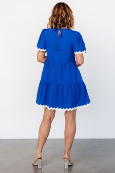 This fun short dress is comfortable and unique! Deep royal blue color Material has no stretch Round neckline Keyhole and self-tie at back Functional side pockets Off-white ric rac trim at sleeve cuffs and hemline Tiered short skirt Fully lined, excluding sleeves Self and Lining: 100% Polyester Marianne is 5'6, cup size 34D, size 6 and wearing size S Royal Blue Short Sleeve Beach Dress, Royal Blue Knee-length Mini Dress For Formal Occasions, Royal Blue V-neck Mini Dress, Royal Blue A-line Mini Dress, Chic Royal Blue V-neck Mini Dress, Dress Royal Blue, Dress Royal, Deep Royal Blue, Dresses Royal