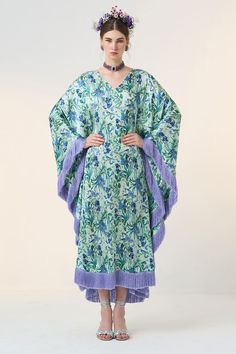 Blue kaftan with all over floral bloom print.
Components: 1
Pattern: Print
Type Of Work: Floral
Neckline: V Neck
Sleeve Type: Batwing Sleeves
Fabric: Satin
Color: Blue
Other Details: 
Silk fringes all over hemline
Occasion: Resort - Aza Fashions Silk Floral Print Floor-length Kaftan, Floor-length Silk Kaftan With Floral Print, Spring Kaftan With Tassels And Kimono Sleeves, Bohemian Floral Print Kaftan For Eid, Bohemian Floral Print Floor-length Kaftan, Floor-length Floral Silk Kaftan, Floor-length Floral Print Kaftan For Spring, Spring Floral Print Floor-length Kaftan, Bohemian Floor-length Floral Print Kaftan