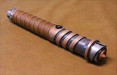 a close up of an object on a table with a brown leather surface in the background