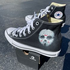 These custom Dandingeroz shoes come in Black High Top Converse. Both shoes have the iconic interpretation of Jason's mask and if you take a closer look, maybe you'll catch a glimps of something much more sinister. The mask will be on the outside of both shoes. These shoes are perfect for the Horror Movie Season and any Friday the 13th fan! Dan Elijah G. Fajardo is a Manila based artist who is the creative mind and owner behind Dandingeroz. Fajardo has mastered his art style and technique through Horror Sneakers, Emo Shoes, Custom Converse Shoes, Cute Converse Shoes, Friday The 13th Jason, Custom Wedding Shoes, Cute Converse, Vampire Aesthetic, Converse Custom