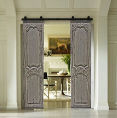 an open door leading into a dining room