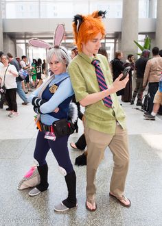 two people dressed up in costumes at an event