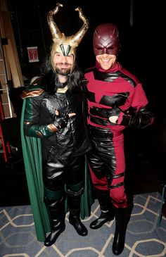 two people in costumes standing next to each other