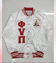 a white and red varsity jacket with the word love on it's front pocket