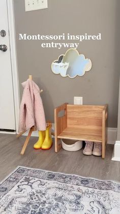 a child's room with a wooden bench and coat rack